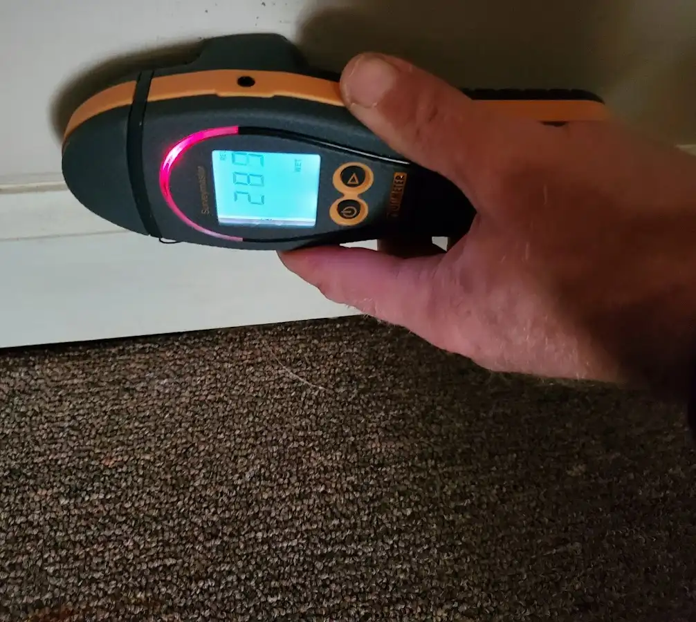 Moisture detection at baseboard during Storm Damage Restoration in Kernersville